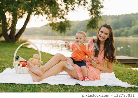 Happy Baby Sitting With Mom On Picnic 122753031
