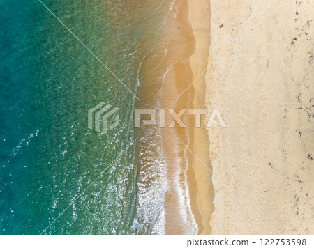 Aerial view Beautiful sea in summer season,Aerial flying drone view Waves water surface texture on sunny tropical ocean in Phuket island Thailand Aerial view Beautiful sea in summer season,Aerial flying drone view Waves water surface texture on sunny tropical ocean in Phuket island Thailand 122753598