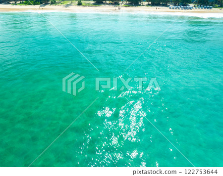 Aerial view of blue sea surface water texture background,Sun reflections on water, Aerial flying drone view Waves water surface texture on sunny tropical ocean in Phuket island Thailand Aerial view of blue sea surface water texture background,Sun reflections on water, Aerial flying drone view Waves water surface texture on sunny tropical ocean in Phuket island Thailand 122753644