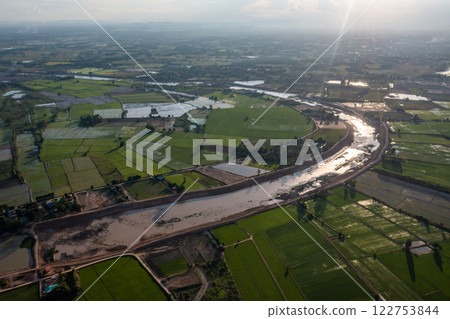 Construction dredges up for a canal and dam, to prevent a flood in the rainy season. Date on 14 May 2021 at Uthai Thani province, Thailand. 122753844