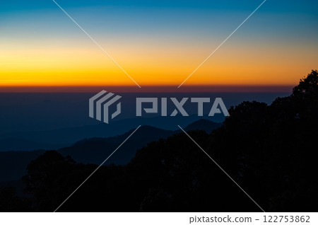 The beautiful sunrise at Doi intanon national park, Chiang Mai in the morning.Sun is rising from the hill to shy with beautiful yellow orange light. 122753862