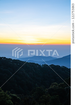 The beautiful sunrise at Doi intanon national park, Chiang Mai in the morning.Sun is rising from the hill to shy with beautiful yellow orange light. 122753863