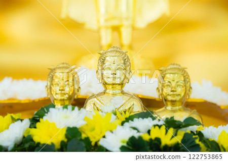 Portrait of three Golden boy Kumanthong top altar with flower. Kumanthong is be soul of a boy and superstition about spiritual in Thailand. 122753865
