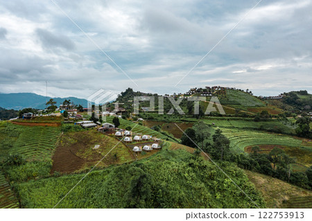 An aerial photographic view of Mon Jam Village in Chiangmai, filled with houses, resorts, and homestays for all the visitors. An aerial photographic view of Mon Jam Village in Chiangmai, filled with houses, resorts, and homestays for all the visitors. 122753913