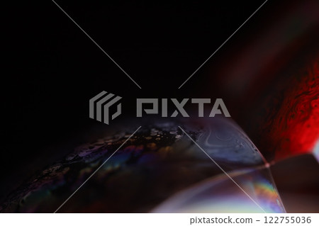 Multicoloured reflection of liquid in macro, white colors, surrealistic background, fantastic smooth movement, water surface, spectrum texture 122755036