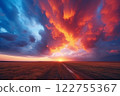 Against the backdrop of a flat and barren desert, the setting sun ignites the sky with dramatic orange and pink clouds, setting an awe-inspiring mood. Created with generative AI tools 122755367