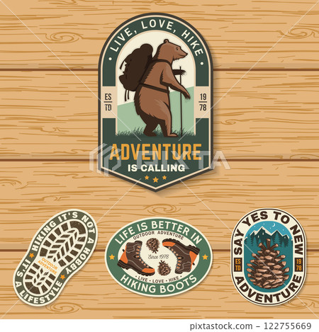 Set of hiking outdoor adventure emblems, patch. Hiking related typographic quote. Design with hiking boot, pine cone, mountains. Set of hiking outdoor adventure emblems, patch. Hiking related typographic quote. Design with hiking boot, pine cone, mountains. 122755669