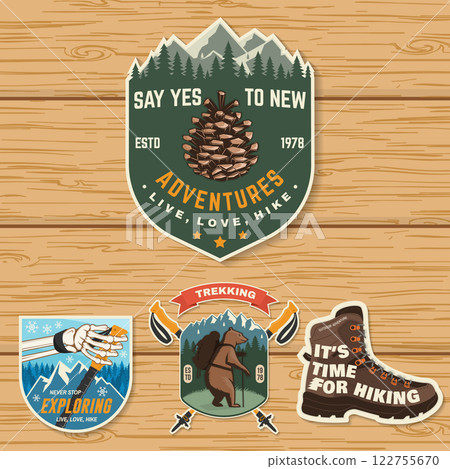 Set of hiking outdoor adventure emblems, patch. Hiking related typographic quote. Design with hiking boot, pine cone, mountains. Set of hiking outdoor adventure emblems, patch. Hiking related typographic quote. Design with hiking boot, pine cone, mountains. 122755670