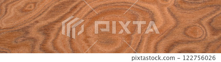 Elm burl veneer surface with a mesmerizing array of cinnamon swirls and deep amber accents 122756026