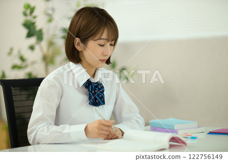 Profile of a high school girl studying 122756149