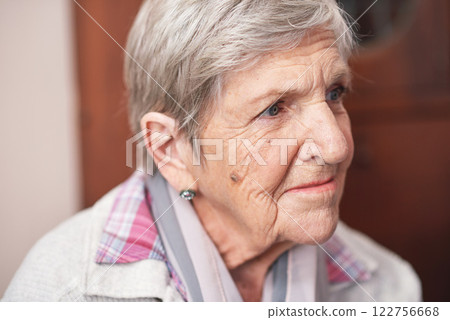 Senior, woman and face or thinking on sofa with relax, peace and freedom in retirement or living room. Elderly, person and thoughtful on couch in lounge of home with confidence, dementia or alzheimer 122756668