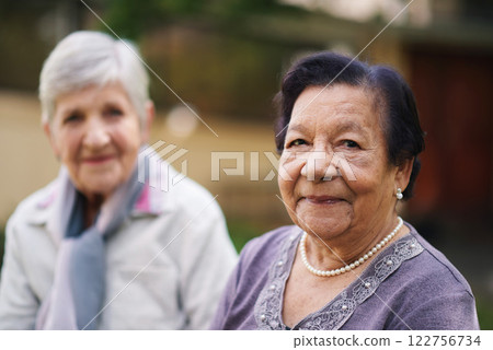 Portrait, outdoor and senior women with a friend, retirement and cheerful with joy, bonding together or weekend break. Face, elderly people and park for fresh air and relaxing with care on vacation 122756734