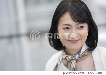 Smiling woman in her 50s 122756885