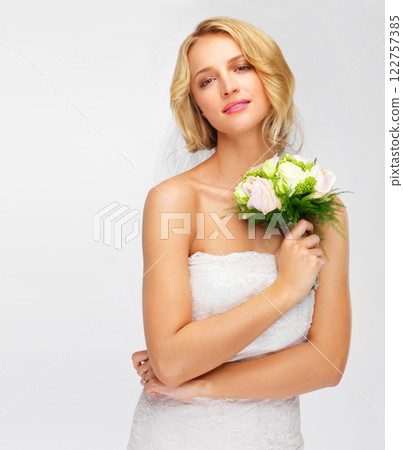 Marriage, wedding and woman or bride in a studio with a bouquet on a white background. Portrait face of a young model with rose flowers, beauty makeup and wedding dress fashion design with mockup Marriage, wedding and woman or bride in a studio with a bouquet on a white background. Portrait face of a young model with rose flowers, beauty makeup and wedding dress fashion design with mockup 122757385