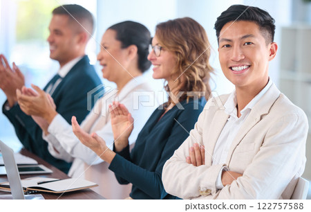 Teamwork, motivation and celebration with clapping business people cheering during speech or presentation. Portrait of a happy employee enjoying his career while sitting with diverse team in training Teamwork, motivation and celebration with clapping business people cheering during speech or presentation. Portrait of a happy employee enjoying his career while sitting with diverse team in training 122757588