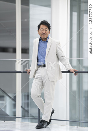 A man in his mid-50s smiling at the camera A man in his mid-50s smiling at the camera 122757750