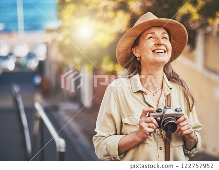 Happy photographer tourist taking photo of historic building with camera, smiling and carefree. Excited mature female solo travel journey, enjoying retirement while looking at bucket list destination Happy photographer tourist taking photo of historic building with camera, smiling and carefree. Excited mature female solo travel journey, enjoying retirement while looking at bucket list destination 122757952