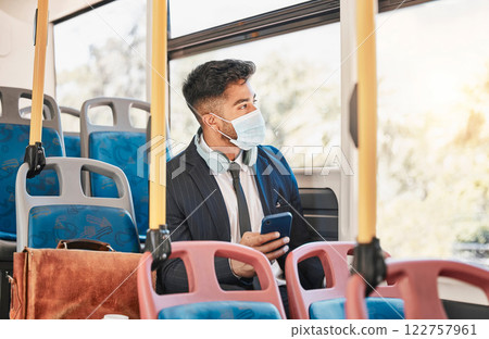 Covid, bus travel and business phone while on public transport commute with pandemic regulations. Worker with face mask protection while travelling to work for virus safety and prevention. 122757961