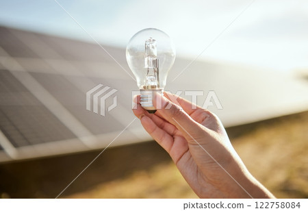 Light bulb, solar panel and farmer hand with energy saving, electricity on sustainable agriculture farming for eco friendly idea. Sustainability, clean energy and carbon capture for green development Light bulb, solar panel and farmer hand with energy saving, electricity on sustainable agriculture farming for eco friendly idea. Sustainability, clean energy and carbon capture for green development 122758084