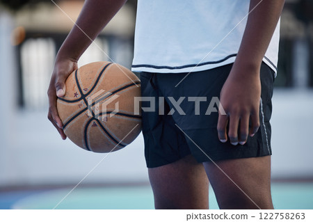 Basketball athlete ready for training, game and competition on sports court from below outdoor. Training, focus and fitness workout black man with motivation, mindset and goal to play, cardio and win Basketball athlete ready for training, game and competition on sports court from below outdoor. Training, focus and fitness workout black man with motivation, mindset and goal to play, cardio and win 122758263