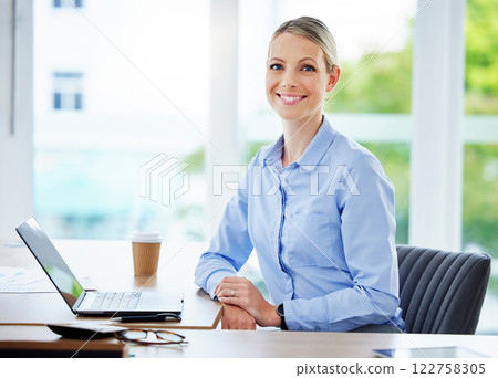 Smiling, happy and proud business woman, entrepreneur and leader working on a laptop in an office. Portrait of a caucasian accounts executive, hr manager and administrator in a corporate agency 122758305