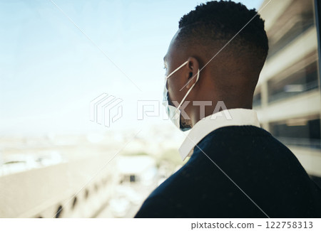 Black businessman with mask in city on business trip or travel for job opportunity success in covid pandemic. Young corporate career, professional man or manager at airport for management event Black businessman with mask in city on business trip or travel for job opportunity success in covid pandemic. Young corporate career, professional man or manager at airport for management event 122758313