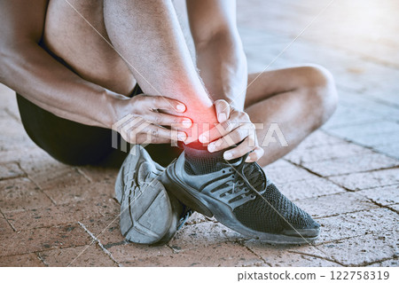 Runner with medical sports running injury and swollen ankle pain. Male athlete treating foot sprain, man with fitness training emergency and sore leg muscle from cardio workout with exercise shoes. Runner with medical sports running injury and swollen ankle pain. Male athlete treating foot sprain, man with fitness training emergency and sore leg muscle from cardio workout with exercise shoes. 122758319