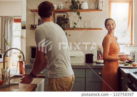 Couple cooking food, household cleaning or food preparation together in their kitchen at home. Laughing, bonding and caring husband and wife helping each other prepare supper, lunch or meal Couple cooking food, household cleaning or food preparation together in their kitchen at home. Laughing, bonding and caring husband and wife helping each other prepare supper, lunch or meal 122758397