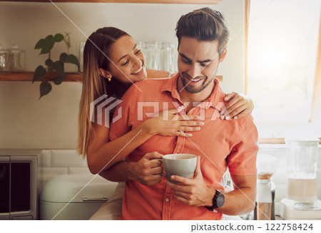 Happy, in love and carefree couple embracing, bonding and being affectionate at home together. Young boyfriend and girlfriend hugging, relaxing, talking, being playing and enjoying their relationship 122758424