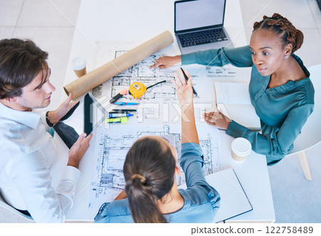 Teamwork, planning and discussing architects working on new building, house or shopping mall design top view. A team, colleagues or workforce with blueprints, designs and plans for a company project 122758489