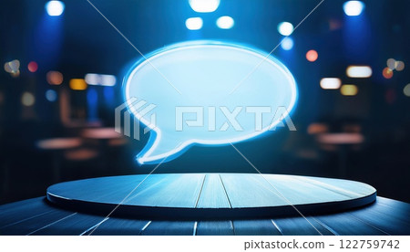 glowing speech bubble icon above round table symbolizes innovative conversation and creativity in modern setting. vibrant atmosphere enhances communication 122759742