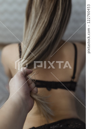 Sexy couple in bed. Human sexual activity. In reality, a man has sex with a girl 122760453