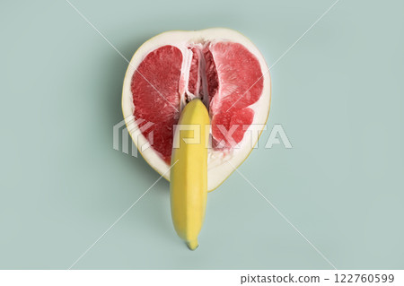 Banana and grapefruit flat lay minimal composition. A metaphor of sex, sexuality, vagina and penis. 122760599