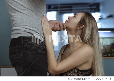Work with your mouth. Sexy girl rubs the zipper on her partner's jeans for oral sex Work with your mouth. Sexy girl rubs the zipper on her partner's jeans for oral sex 122760621