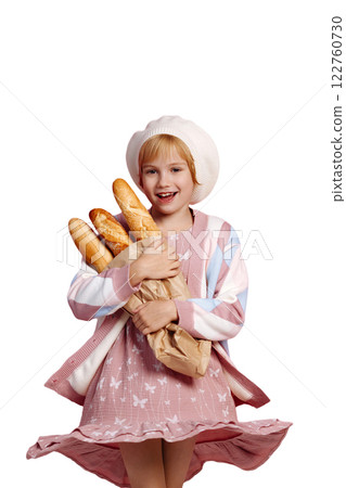 Young baker girl holding baguettes isolated on white background with copy space Young baker girl holding baguettes isolated on white background with copy space 122760730