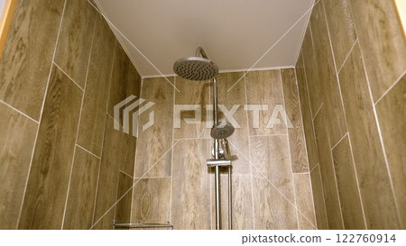 Modern shower head in contemporary bathroom 122760914