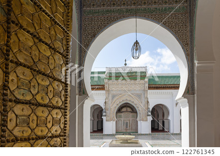 Rich decorated facade in the courtyard of the Medersa Attarine in Fes, Morocco Rich decorated facade in the courtyard of the Medersa Attarine in Fes, Morocco 122761345