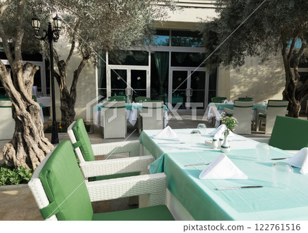 Cafe tables and chairs outside in Antalya Turkey hotel resort Cafe tables and chairs outside in Antalya Turkey hotel resort 122761516