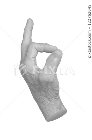 Elderly female hand with wrinkled skin showing an OK gesture, symbolizing approval, success, and 122762645