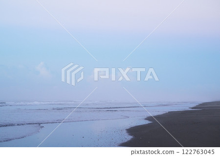 Tranquil seaside scene with gentle waves 122763045