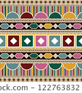 Indian ethnic tribal fabric pattern in a geometric style, featuring playful pink, green, and red tones. The ethnic bright colors add energy and liveliness, making this design ethnic both fun. This 122763832