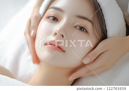 Young woman receiving a facial massage at a beauty clinic 122763839