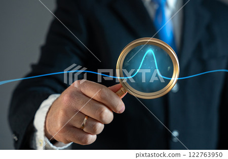 A businessman studies an abnormal jump on a chart. Sales growth. High profitability. Market demand surges, investment opportunities, stock market fluctuations. High profitability 122763950