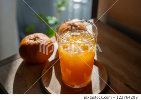 Freshly squeezed homemade mandarin juice Freshly squeezed homemade mandarin juice 122764299