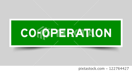 Green color square shape sticker label with word co operation on gray background 122764427