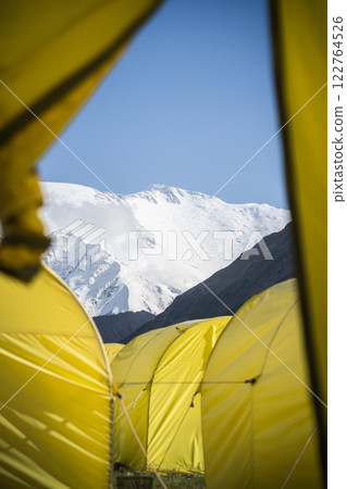 Vertical shot of view on Lenin Peak captured from expedition tent , Pamir Mountains, Kyrgyzstan Vertical shot of view on Lenin Peak captured from expedition tent , Pamir Mountains, Kyrgyzstan 122764526