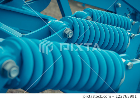 Steel blue spring as part of agricultural machine. Technology 122765991