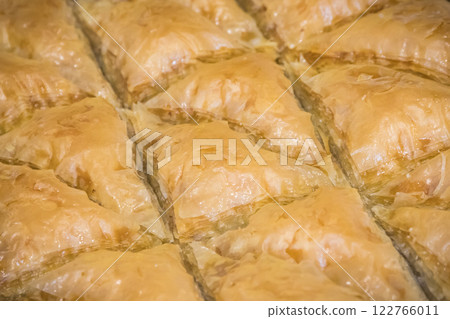 Turkisch baklava. Sweet pastry made of layers filo dough with walnuts and honey 122766011