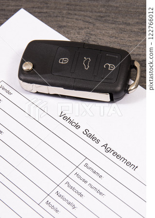 Car key and vehicle sales agreement. Sales or purchases new or used vehicle 122766012