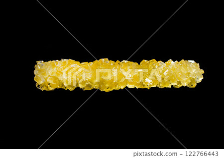 Crystallized sugar, bright yellow-orange crystals on a black background, refined product, with a place for an inscription 122766443